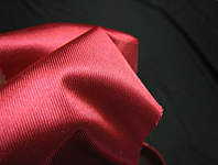 Photo of satin tricot construction in red.